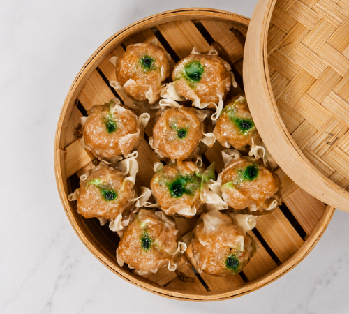 RTK Beef Siomai served in an open bamboo steamer basket.