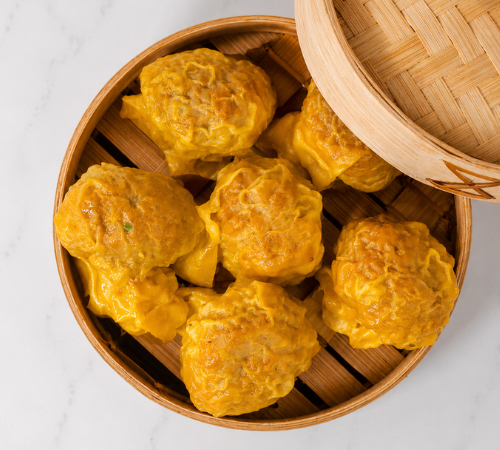 RTK Big Chicken Siomai served in an open bamboo steamer basket.