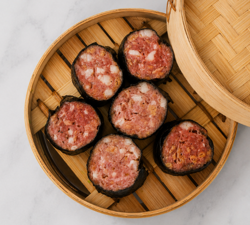 RTK Big Japanese Siomai served in an open bamboo steamer basket.