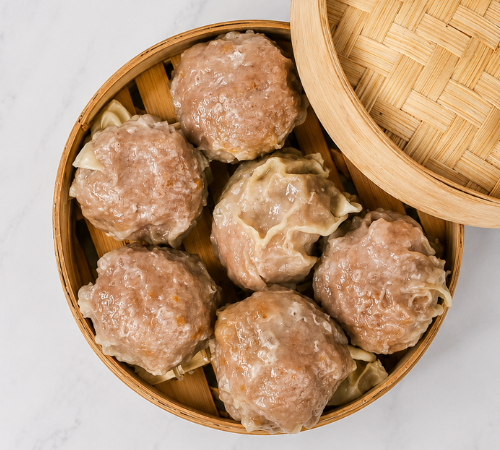 RTK Big Pork Siomai served in an open bamboo steamer basket.