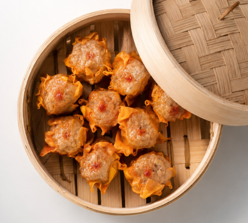 RTK Pork Siomai served in an open bamboo steamer basket.