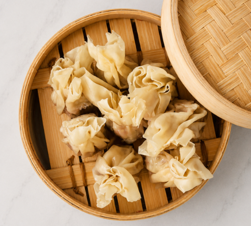 RTK Wanton Dumpling served in an open bamboo steamer basket.